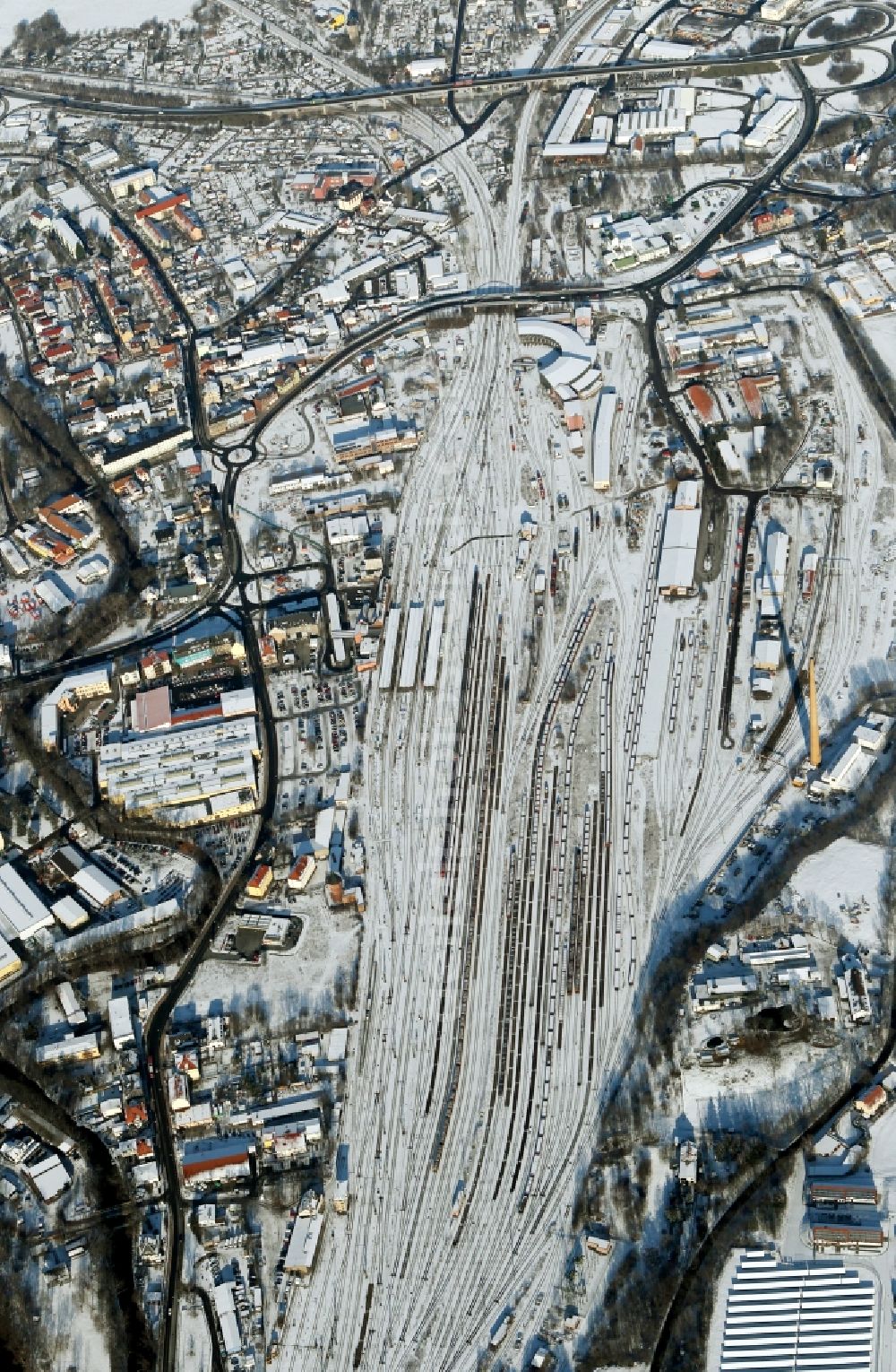 Aerial image Saalfeld/Saale - Wintry snowy marshalling yard and freight station of the Deutsche Bahn in Saalfeld/Saale in the state Thuringia