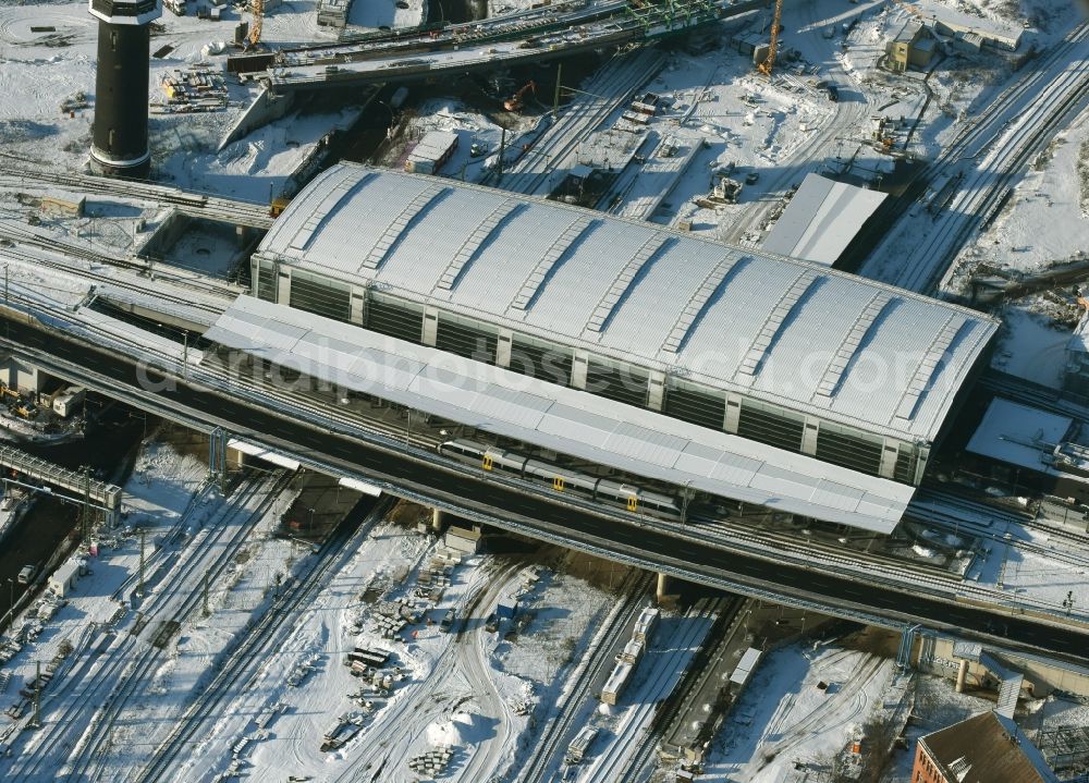 Berlin from above - Wintry snowy terrain route expansion station - Warschauer road to east cross rail station Ostkreuz Friedrichshain district of Berlin