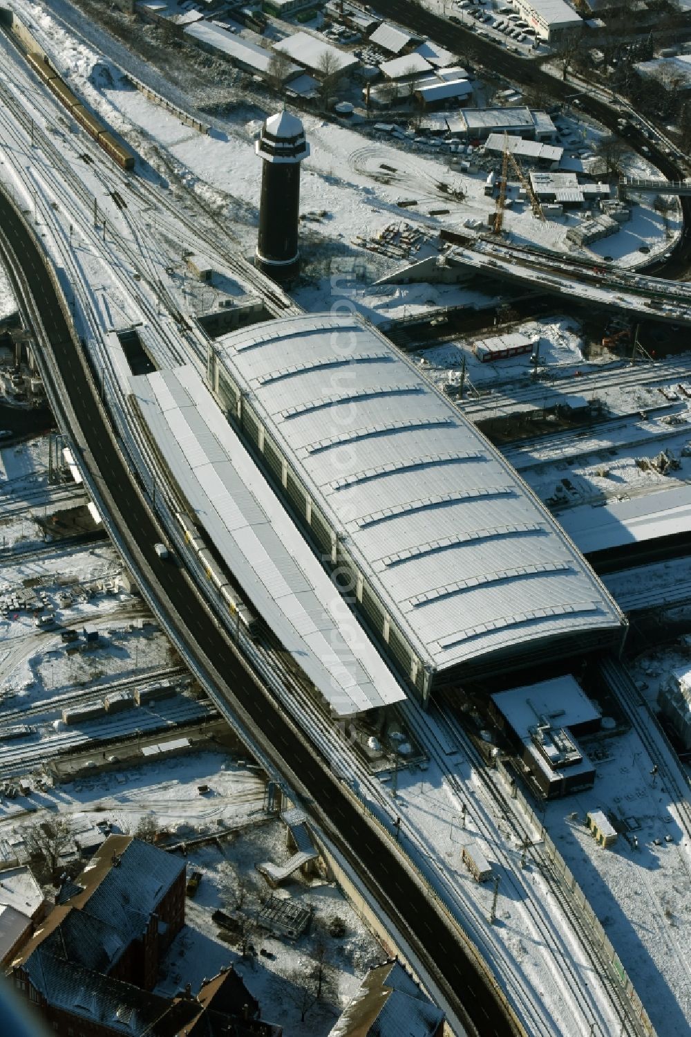 Aerial image Berlin - Wintry snowy terrain route expansion station - Warschauer road to east cross rail station Ostkreuz Friedrichshain district of Berlin