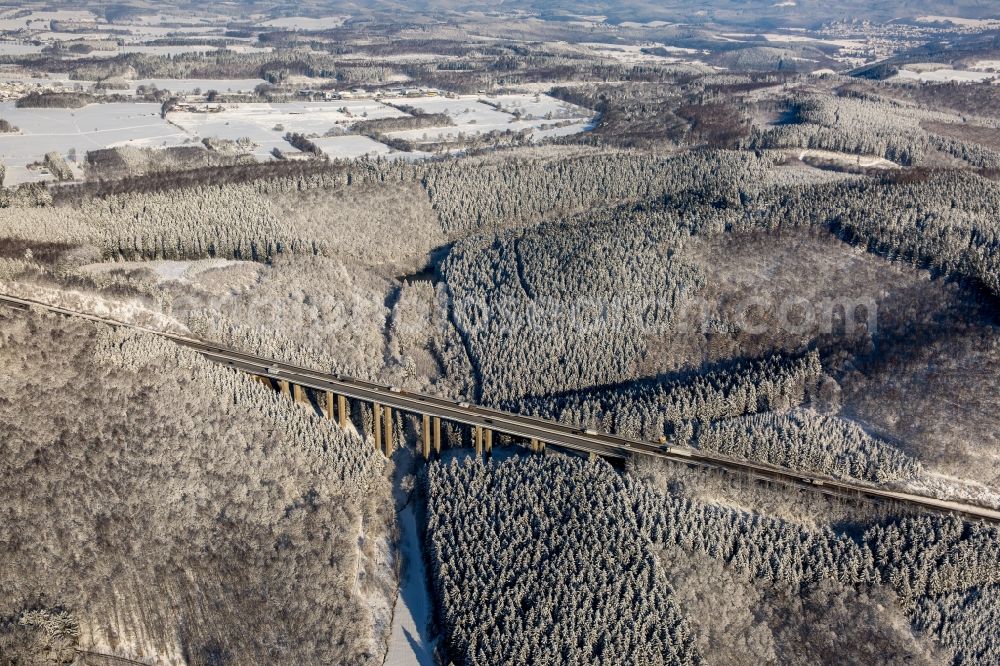 Aerial image Freudenberg - Wintry snowy routing and traffic lanes over the highway bridge in the motorway A 45 in Freudenberg in the state North Rhine-Westphalia