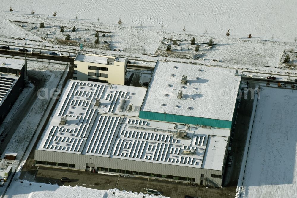 Berlin from above - Snow-covered building of the companies Ahlberg Metalltechnik GmbH and Werner Scholz GmbH in the technology park of Adlershof in Berlin in Germany