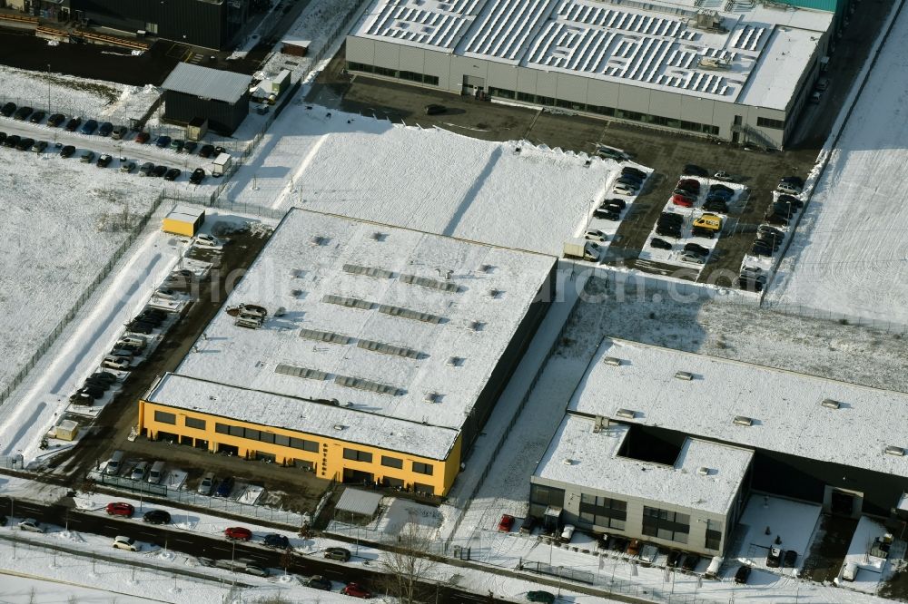 Aerial image Berlin - Snow-covered building of the Karlheinz Gutsche GmbH- Feinoptische Werkstaetten company in the technology park of Adlershof in Berlin in Germany