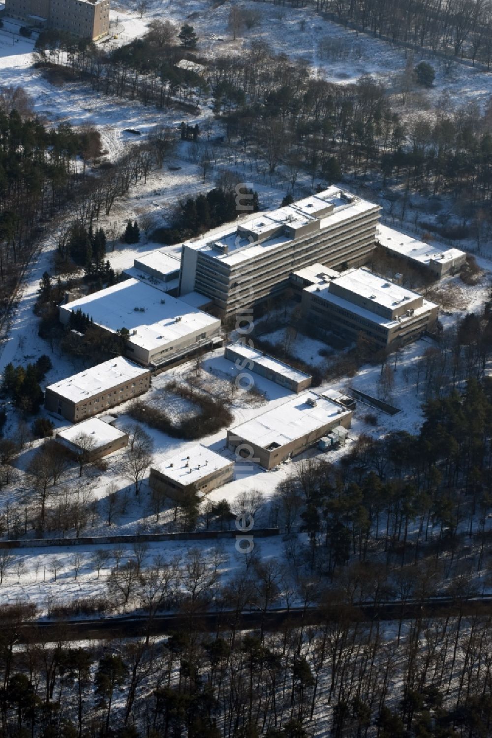 Aerial photograph Berlin - Building of the former hospital of the Stasi Ministry for State Security of the GDR at the Hobrechtsfelder Chaussee Street / Wiltbergstrasse in Berlin-Buch