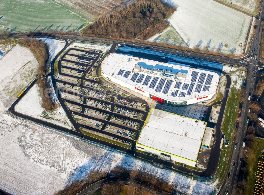 Hamm from above - Wintry snowy building of the store - furniture market finke Das Erlebnis-Einrichten GmbH & Co. KG in Hamm in the state North Rhine-Westphalia