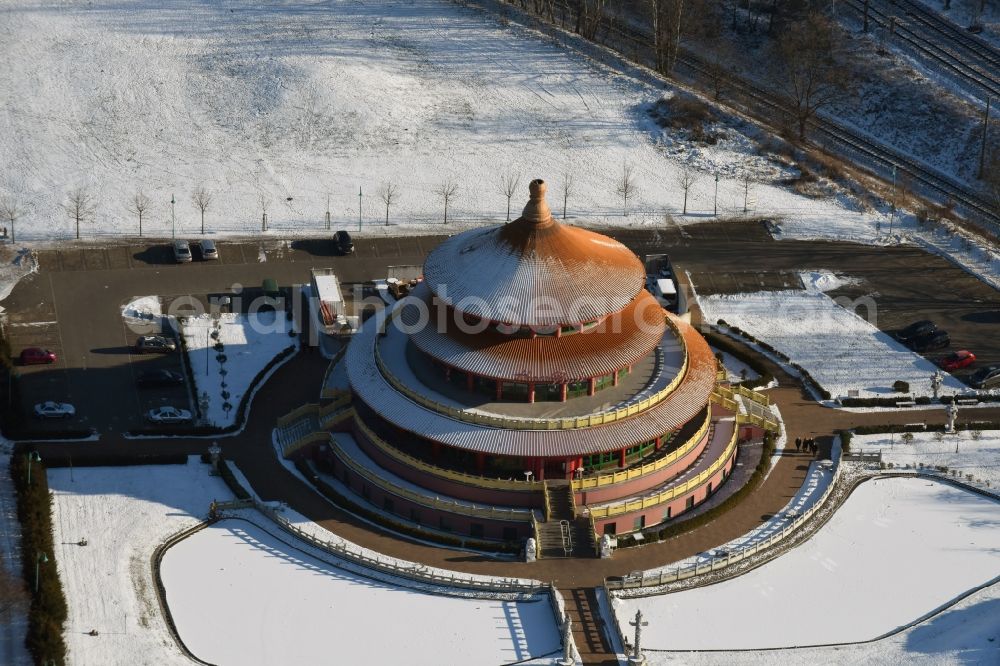 Aerial photograph Hohen Neuendorf - Wintry snowy Building of the restaurant Himmelspagode Himmelspagode an der Oranienburger Strasse in Hohen Neuendorf in the state Brandenburg