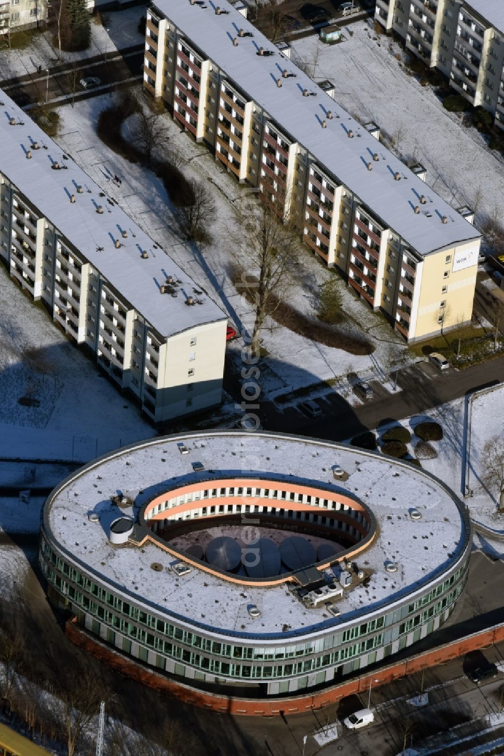 Aerial image Hennigsdorf - Winterly snowy Town Hall building of the city administration in Rathausplatz in Hennigsdorf in the state Brandenburg. The architects ludeloff und ludeloff designed the building which won the RIBA-Award 2004 as well as the Mies van der Rohe Award 2005