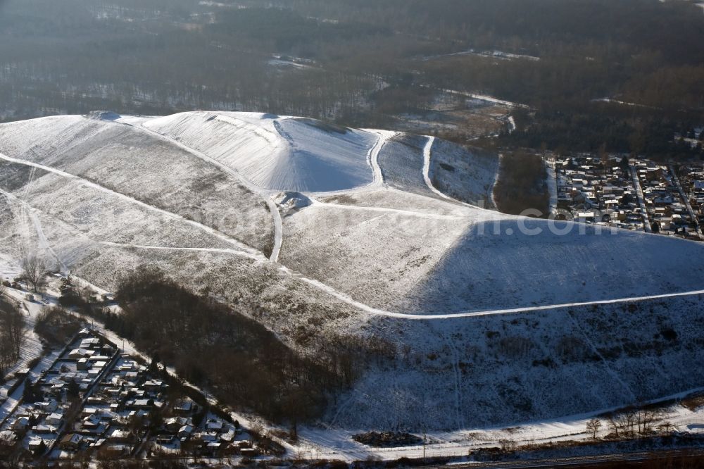 Berlin from above - Wintry snowy site of heaped landfill in Berlin in Germany