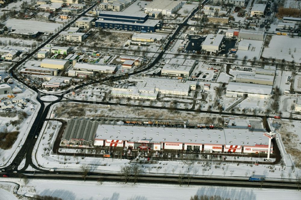 Aerial image Hoppegarten - View of the winterly snowy industrial estate Hoppegarten in the state of Brandenburg