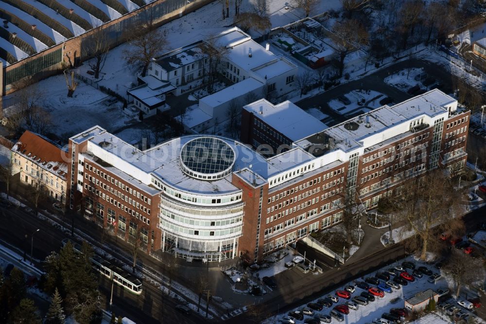 Magdeburg from above - Winterly snowy banking administration building of the financial services company Sparkasse in Luebecker Strasse in Magdeburg in the state Saxony-Anhalt