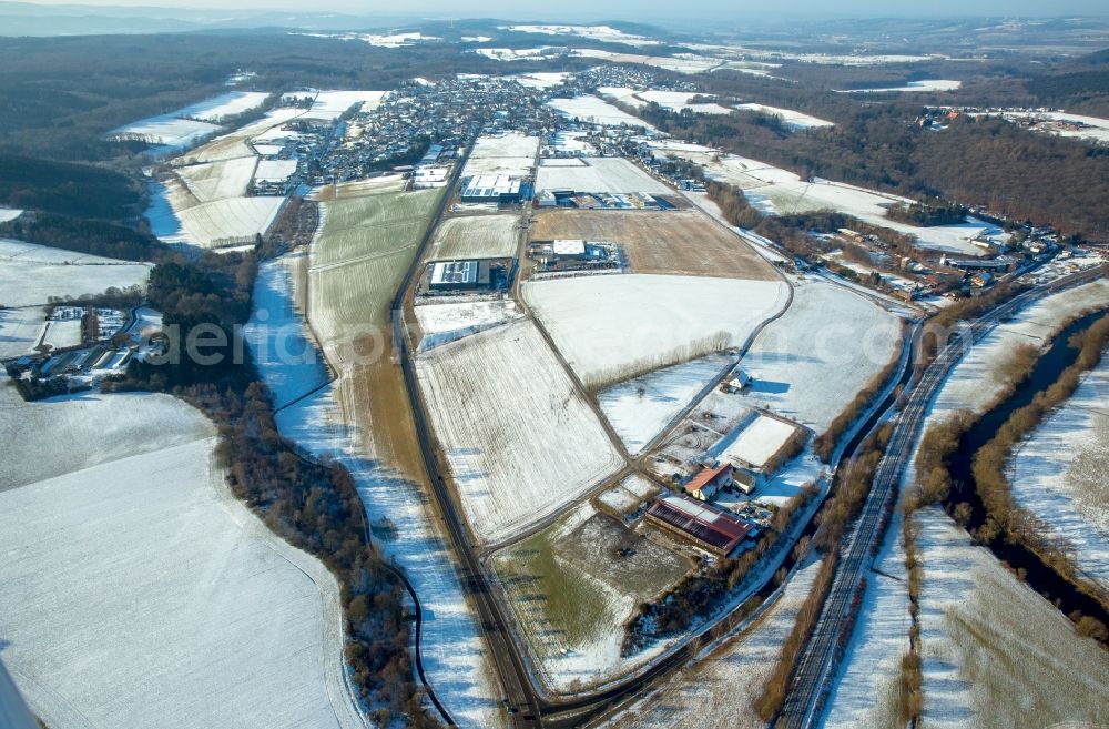 Arnsberg from the bird's eye view: Wintry snowy industrial and commercial area in the district Bachum in Arnsberg in the state North Rhine-Westphalia