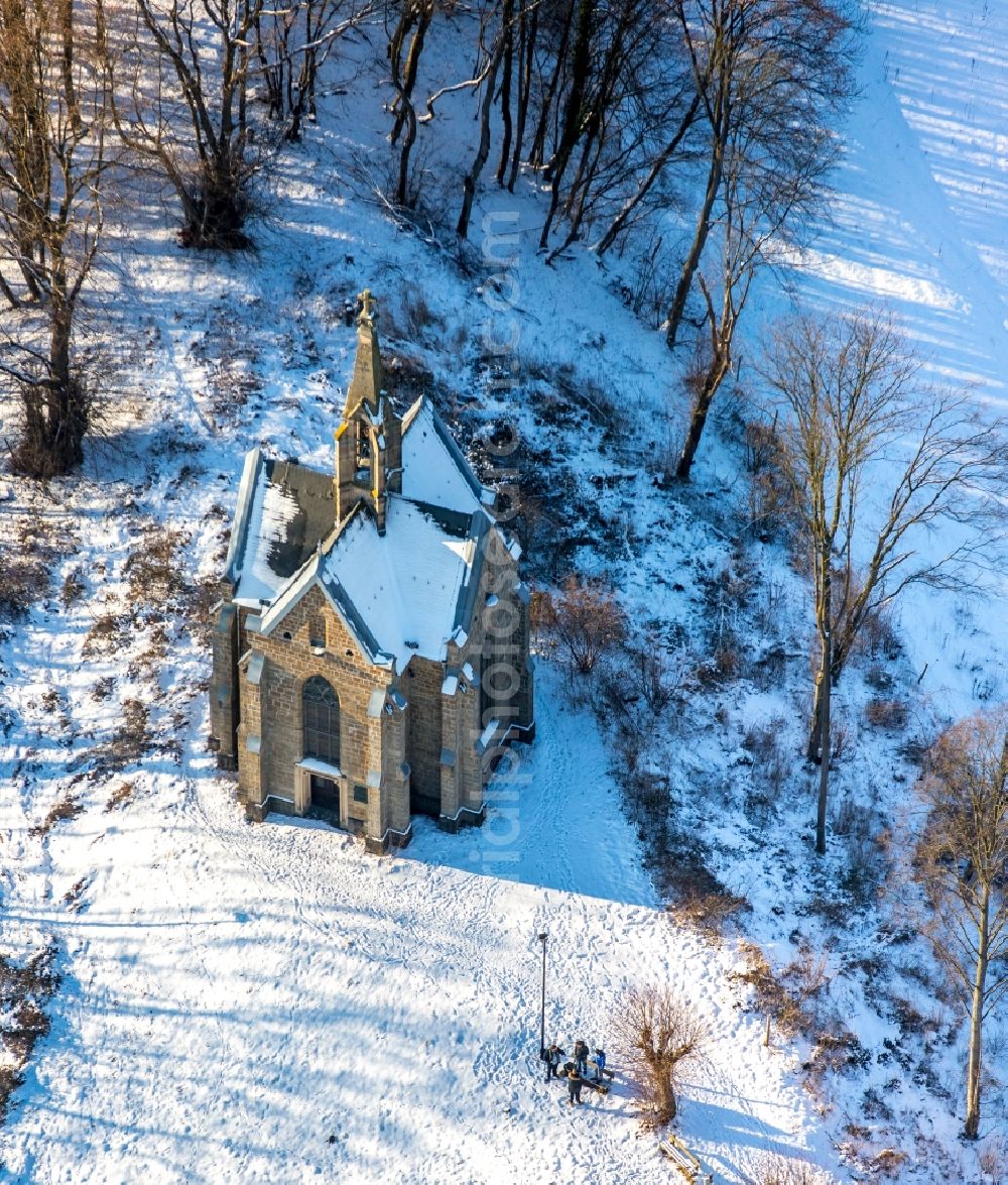 Arnsberg from the bird's eye view: Wintry snowy church building of the chapel in Arnsberg in the federal state North Rhine-Westphalia