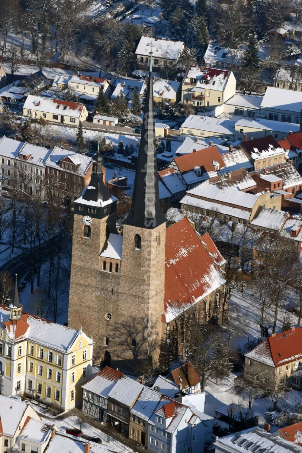 Burg from above - Winterly snowy church building in Unser Lieben Frauen Old Town- center of downtown in Burg in the state Saxony-Anhalt