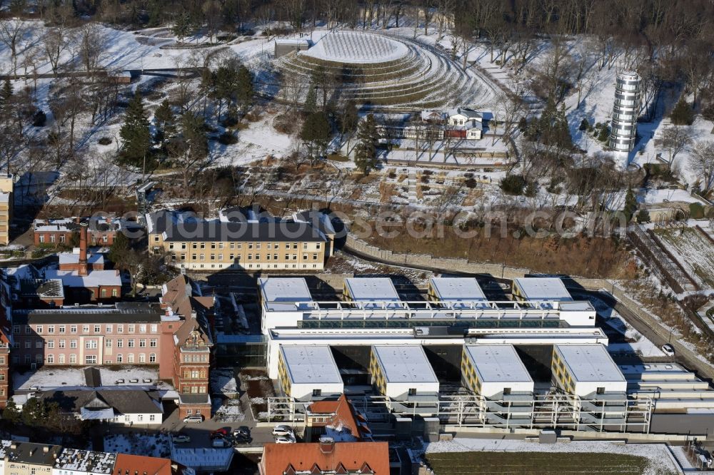 Brandenburg an der Havel from above - Winterly snowy clinic on the hospital grounds Staedtisches Klinikum in Brandenburg an der Havel in the state Brandenburg. In the back are an elevated water reservoir and the viewing tower Friedenswarte