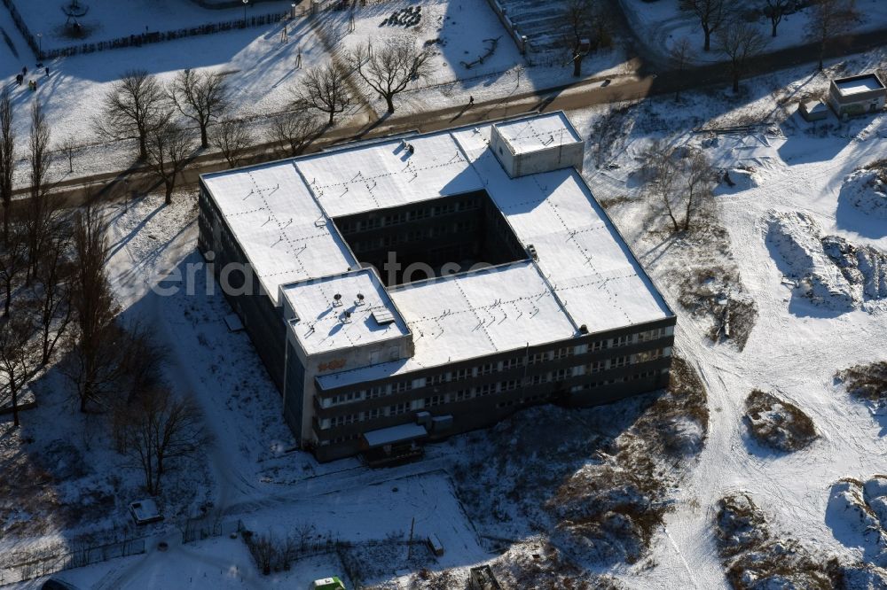 Berlin from above - Winterly snowy vacant, unused office buildings - administrative and business center on the district Buch in Berlin