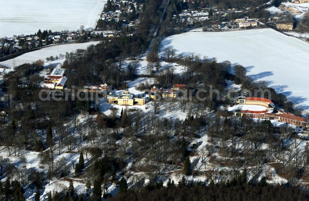 Weimar from above - Wintry snow-covered palace and castle Belvedere with the musical high school and the orangery in Weimar in the state of Thuringia