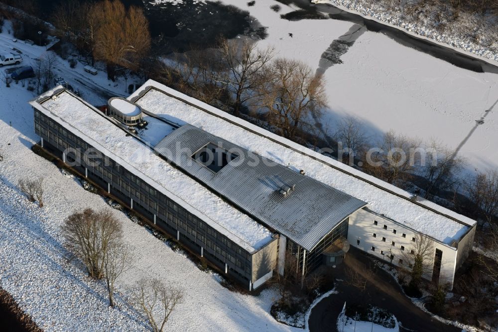 Magdeburg from the bird's eye view: Wintry snowy administrative building of the State Authority WSNBA Wasserstrassen-Neubauamt am Kleiner Werder in Magdeburg in the state Saxony-Anhalt