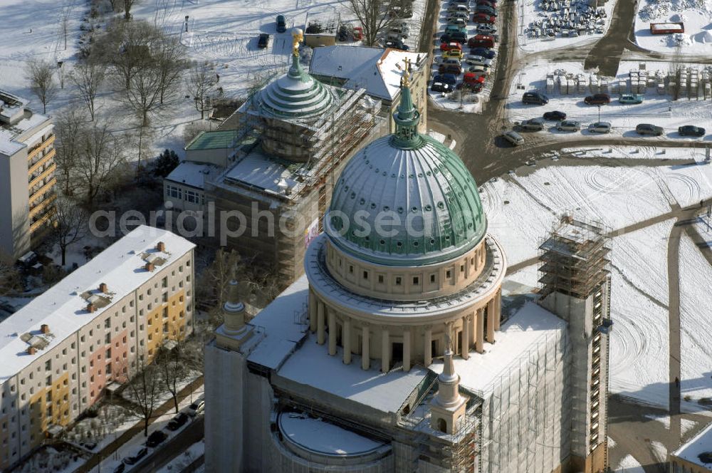 POTSDAM from the bird's eye view: Blick auf die winterlich verschneite eingerüstete Nikolaikirche am Alten Markt in Potsdam, welche von Karl Friedrich Schinkel entworfen wurde. Kontakt: Evangelische St. Nikolai-Kirchengemeinde, Am Alten Markt, 14467 Potsdam, Tel. 0331 2708602, Fax 0331 23700066, email: info@NikolaiPotsdam.de