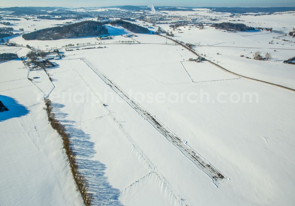 Brilon from above - Wintery snow-covered runway and environment - taxiway grounds of the airfield in the district Thuelen in Brilon in the state North Rhine-Westphalia