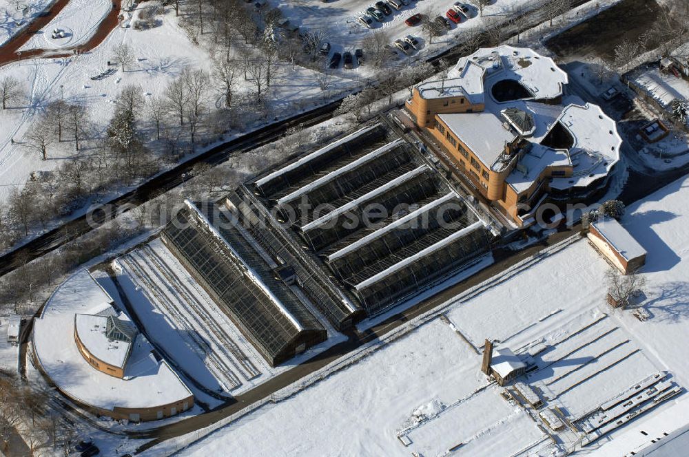 Berlin from above - Blick auf den winterlich verschneiten Gewächshauskomplex an der Mohriner Allee am Britzer Garten