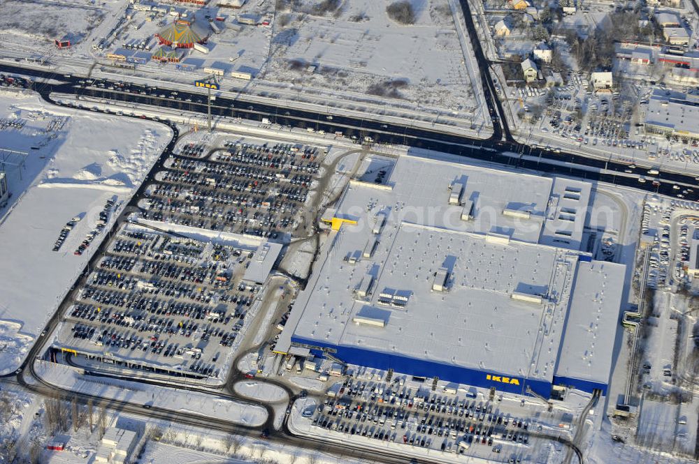 Berlin from above - Winterlich verschneiter IKEA-Neubau Berlin Lichtenberg an der Landsberger Allee , dem zweitgrößte Ikea-Standort in Europa mit 22 000 Quadratmetern und zugleich dem dritten Berliner Einrichtungshaus. View of the IKEA store area in Berlin Lichtenberg. It is the third furniture store in Berlin.