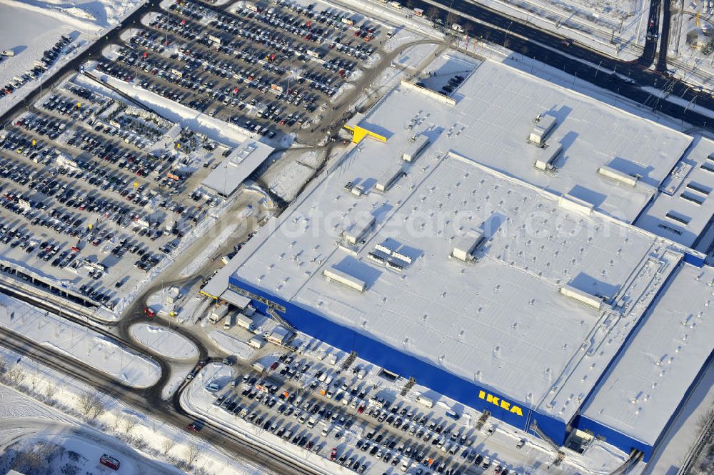 Aerial image Berlin - Winterlich verschneiter IKEA-Neubau Berlin Lichtenberg an der Landsberger Allee , dem zweitgrößte Ikea-Standort in Europa mit 22 000 Quadratmetern und zugleich dem dritten Berliner Einrichtungshaus. View of the IKEA store area in Berlin Lichtenberg. It is the third furniture store in Berlin.