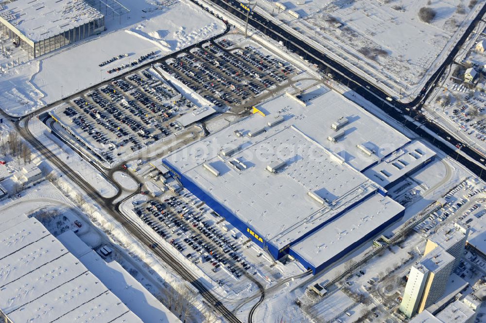 Berlin from above - Winterlich verschneiter IKEA-Neubau Berlin Lichtenberg an der Landsberger Allee , dem zweitgrößte Ikea-Standort in Europa mit 22 000 Quadratmetern und zugleich dem dritten Berliner Einrichtungshaus. View of the IKEA store area in Berlin Lichtenberg. It is the third furniture store in Berlin.