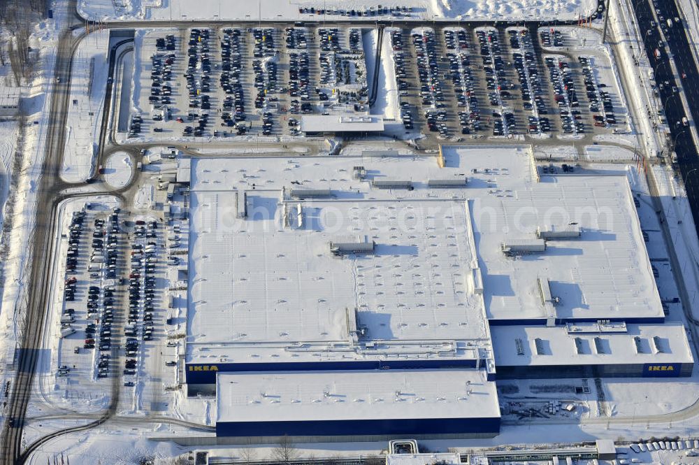 Aerial photograph Berlin - Winterlich verschneiter IKEA-Neubau Berlin Lichtenberg an der Landsberger Allee , dem zweitgrößte Ikea-Standort in Europa mit 22 000 Quadratmetern und zugleich dem dritten Berliner Einrichtungshaus. View of the IKEA store area in Berlin Lichtenberg. It is the third furniture store in Berlin.