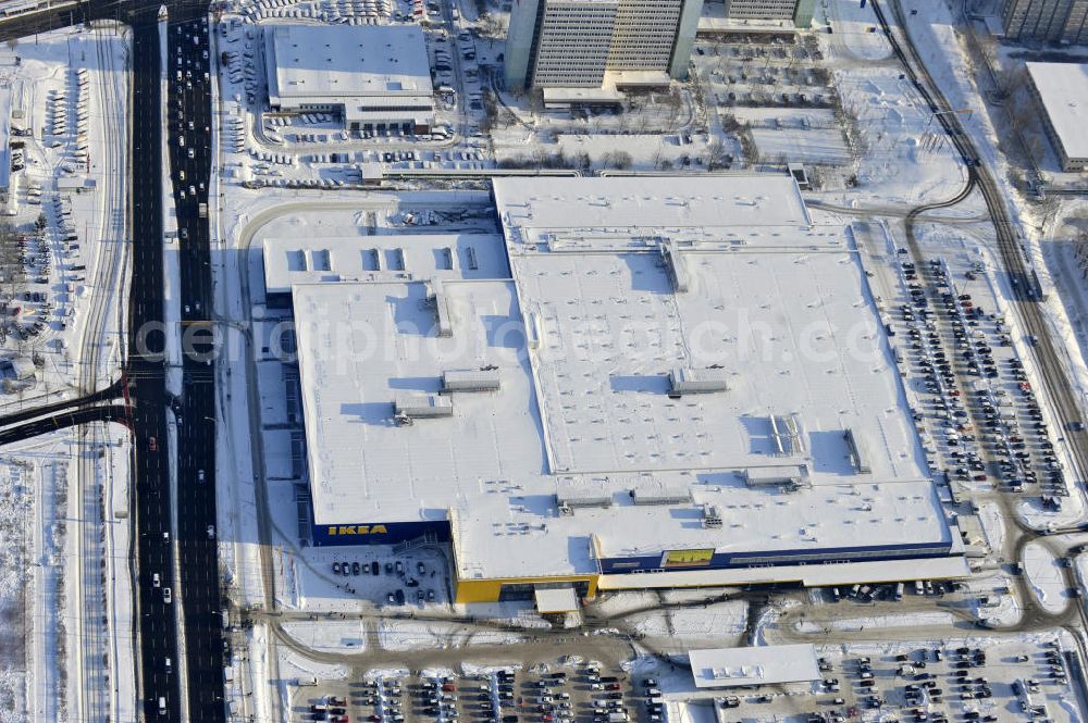 Berlin from above - Winterlich verschneiter IKEA-Neubau Berlin Lichtenberg an der Landsberger Allee , dem zweitgrößte Ikea-Standort in Europa mit 22 000 Quadratmetern und zugleich dem dritten Berliner Einrichtungshaus. View of the IKEA store area in Berlin Lichtenberg. It is the third furniture store in Berlin.