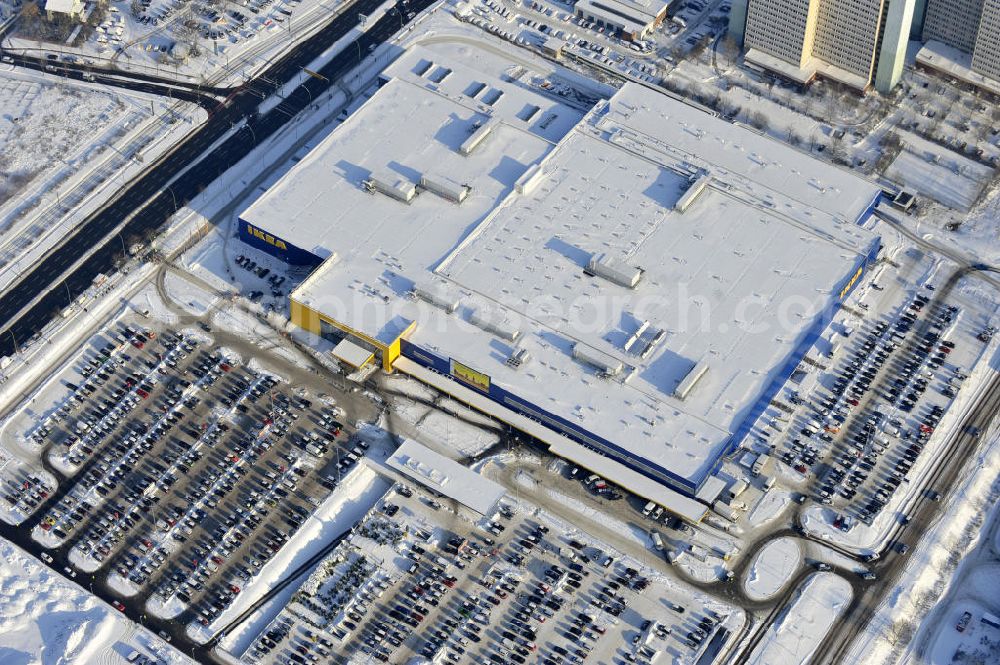 Aerial image Berlin - Winterlich verschneiter IKEA-Neubau Berlin Lichtenberg an der Landsberger Allee , dem zweitgrößte Ikea-Standort in Europa mit 22 000 Quadratmetern und zugleich dem dritten Berliner Einrichtungshaus. View of the IKEA store area in Berlin Lichtenberg. It is the third furniture store in Berlin.