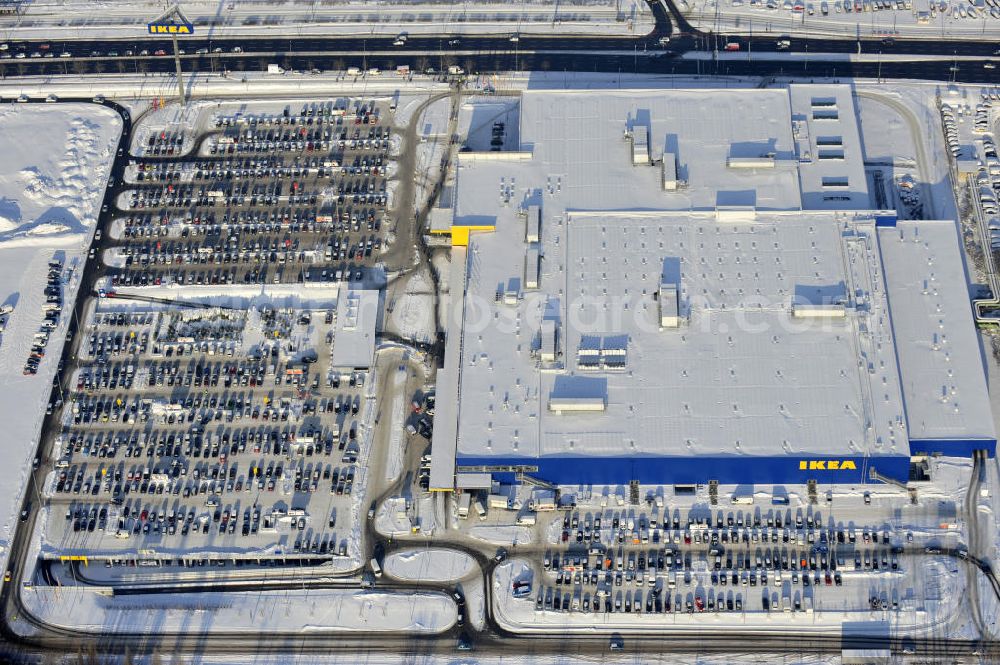 Berlin from above - Winterlich verschneiter IKEA-Neubau Berlin Lichtenberg an der Landsberger Allee , dem zweitgrößte Ikea-Standort in Europa mit 22 000 Quadratmetern und zugleich dem dritten Berliner Einrichtungshaus. View of the IKEA store area in Berlin Lichtenberg. It is the third furniture store in Berlin.