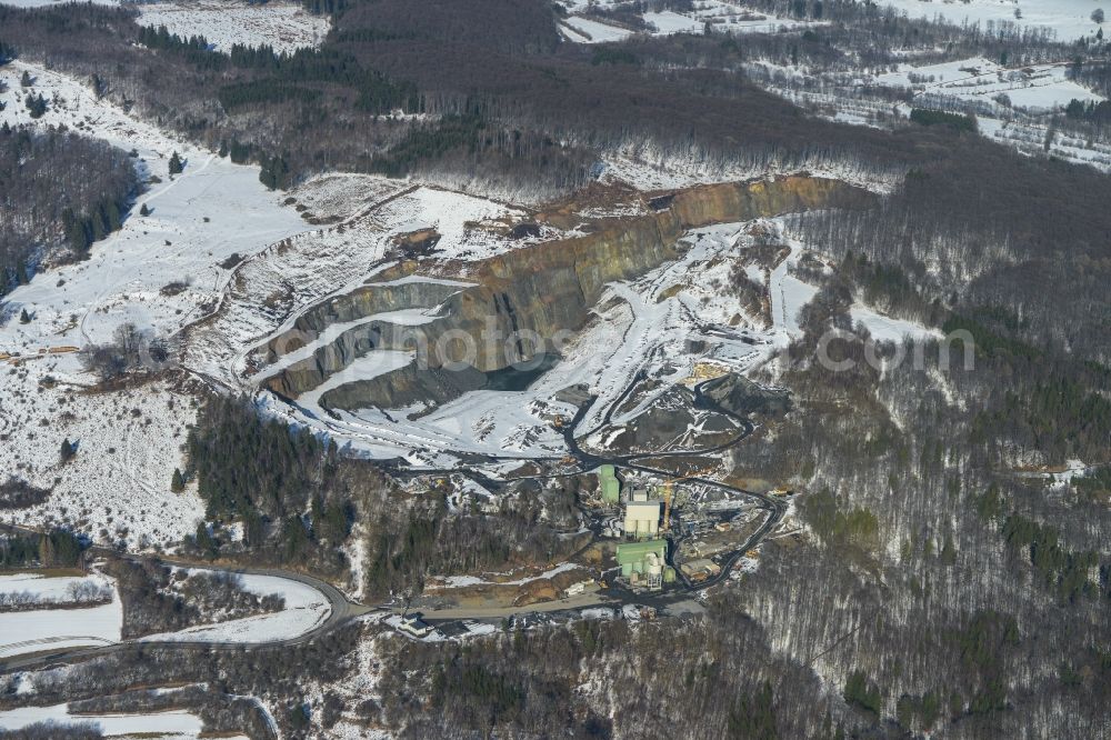 Bischofsheim from the bird's eye view: View of the wintry snowy quarry at Rhoen in winter in Bischofsheim in the state of Bavaria