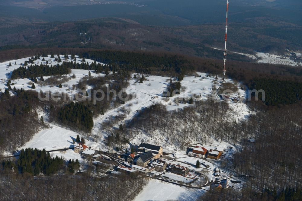 Bischofsheim from the bird's eye view: View of the wintry snowy abbey Kreuzberg in Bishofsheim in the state of Bavaria. Die verschneite Anlage der Franziskaner wurde im 17. Jahrhundert errichtet