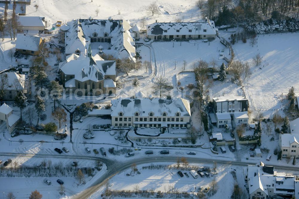 Bochum from above - Blick auf das winterlich verschneite Kloster Stiepel in Bochum, Nordrhein-Westfalen. Das Kloster wurde 1988 gegründet und untersteht dem Abt von Stift Heiligenkreuz, einer Abtei in Österreich. Das Kloster gilt als ein Wallfahrtsort der katholischen Kirche. View of the snowy winter monastery Stiepel in Bochum, North Rhine-Westphalia. The monastery was founded in 1988 and is subject to the Abbot of Heiligenkreuz, a monastery in Austria. The monastery is a place of pilgrimage of the Catholic Church.