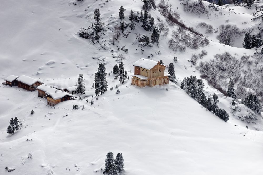 Aerial image Garmisch-Partenkirchen - Wintry snowy King's House on Schachen south of Garmisch-Partenkirchen in the rocks and mountains of the Wetterstein mountains in the state of Bavaria. The castle made of wood was built by Koenig Ludwig