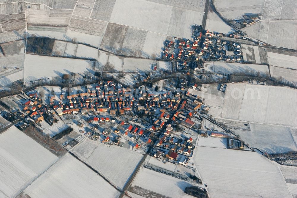 Badenheim from the bird's eye view: Village view of Badenheim in winter with snow in the state Rhineland-Palatinate