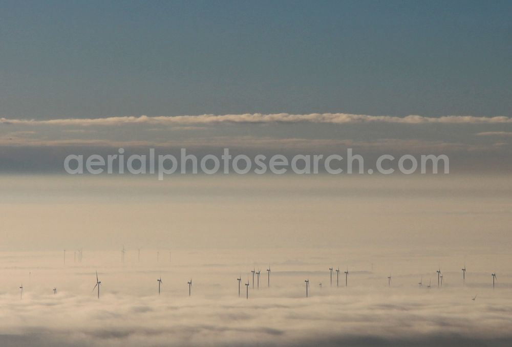 Tempelfelde from the bird's eye view: Wintry inversion - wind turbines in heavy fog on a field in Tempelfelde in Brandenburg