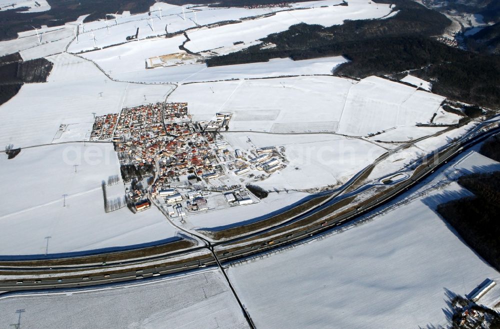 Bucha from the bird's eye view: View of the snow-covered village of Bucha at the federal motorway A4 in the state of Thuringia