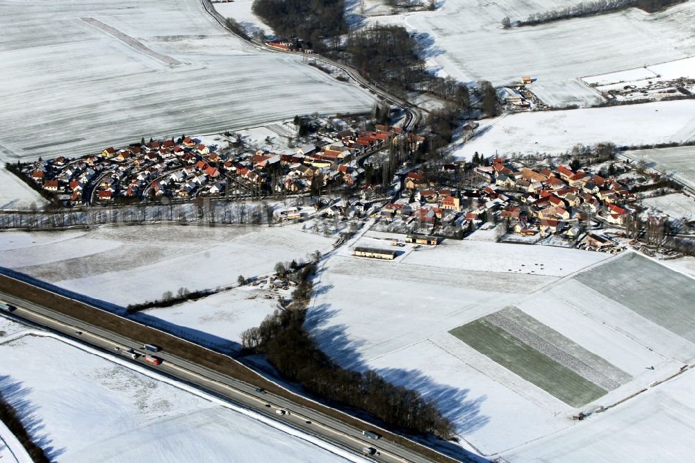 Aerial photograph Magdala - View of the snow-covered village of Goettern at the federal motorway A4 in the state of Thuringia