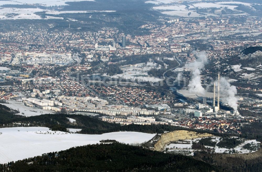 Jena from above - Wintry view of snow-covered Jena in the state of Thuringia. The foreground shows the power plant of the Burgau part