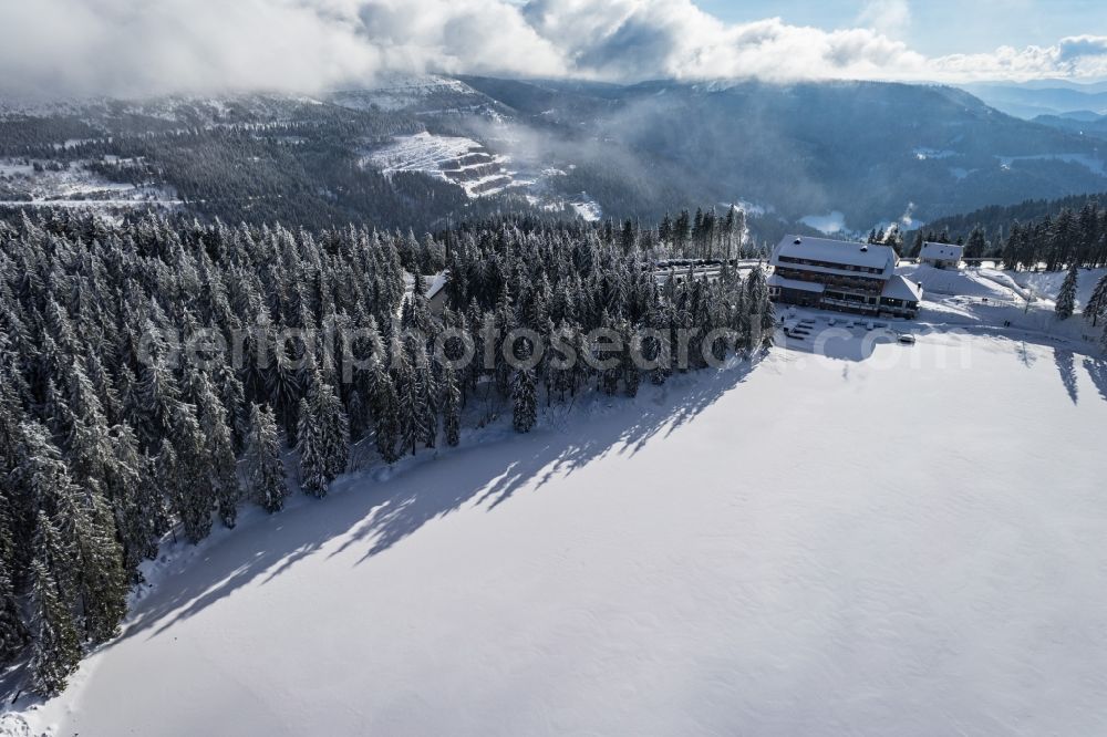 Aerial photograph Seebach - Wintry snowy Riparian areas on the lake area of Mummelsee in Seebach in the state Baden-Wuerttemberg