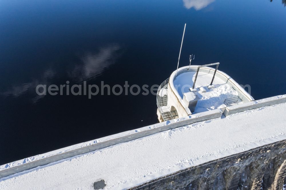 Aerial image Forbach - Wintry snowy Dam and shore areas at the lake Schwarzenbachtalsperre in Forbach in the state Baden-Wuerttemberg