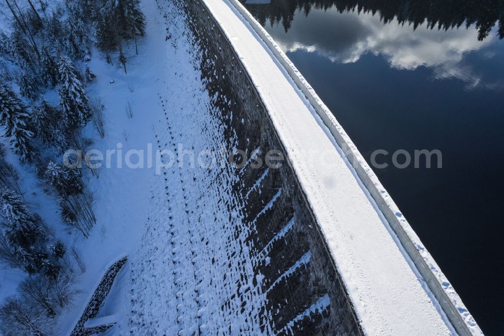 Forbach from above - Wintry snowy Dam and shore areas at the lake Schwarzenbachtalsperre in Forbach in the state Baden-Wuerttemberg