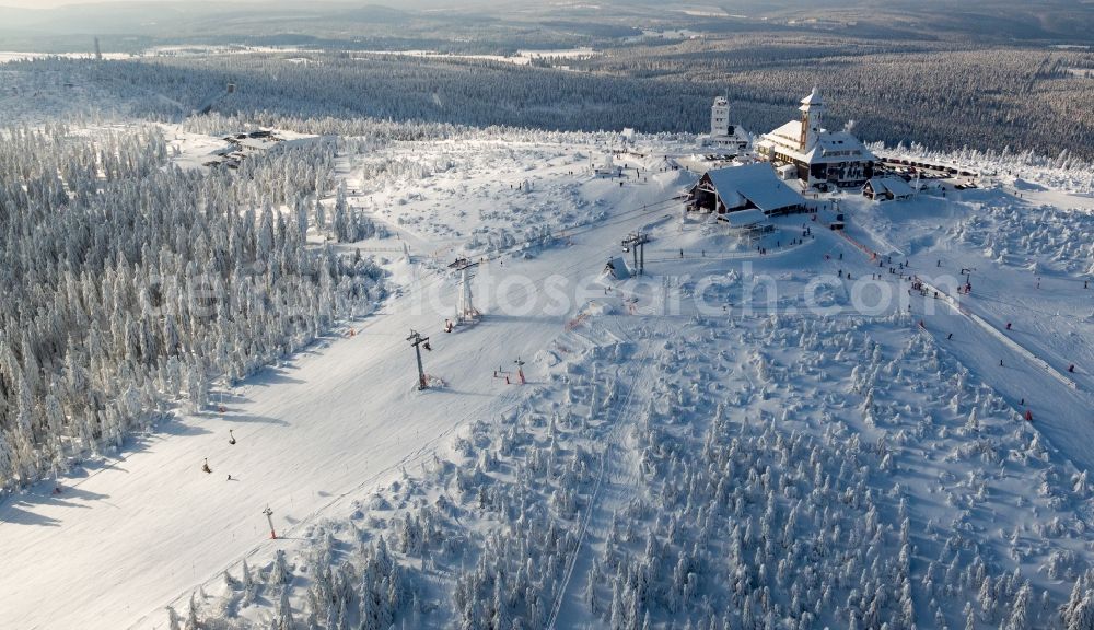 Kurort Oberwiesenthal from above - Wintry snowy mountain slope with downhill ski aerea on Fichtelberg in Kurort Oberwiesenthal in the state Saxony, Germany