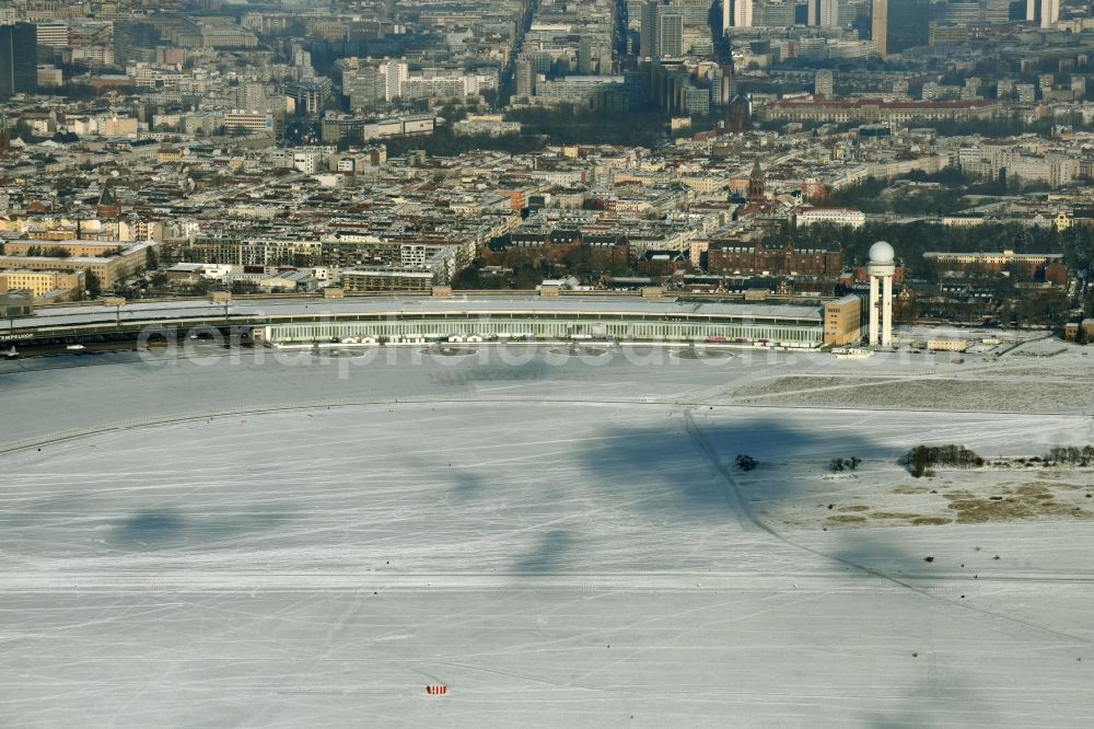 Aerial photograph Berlin - Wintry snowy dispatch building and terminals on the premises of the formerly airport in the district Tempelhof in Berlin, Germany