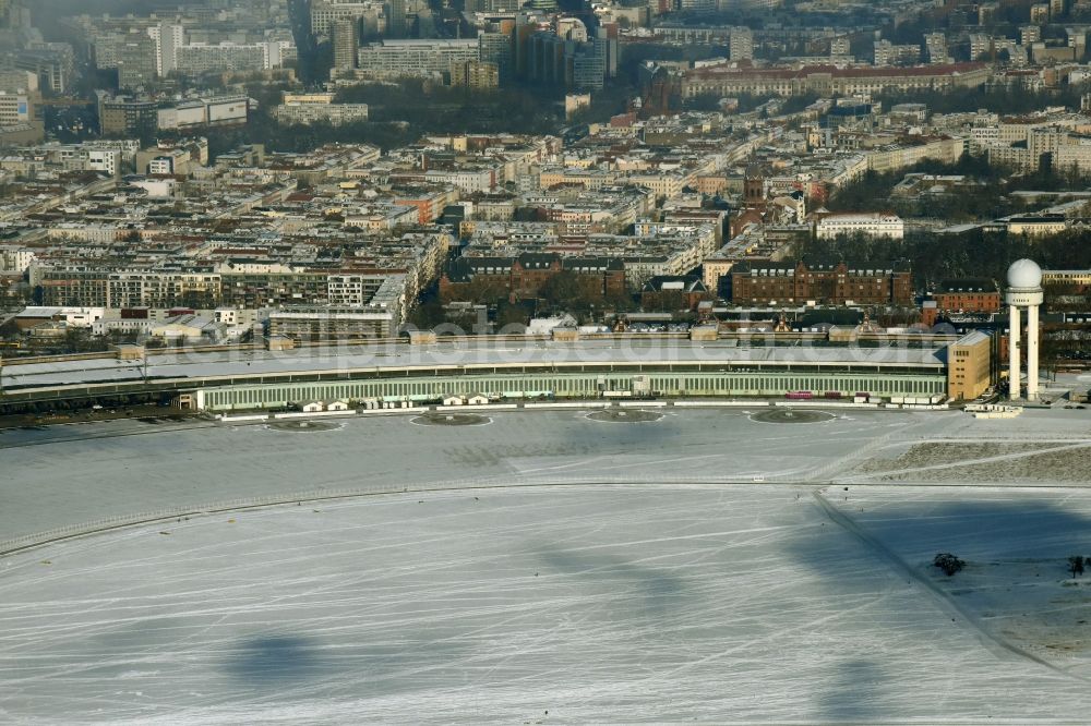 Aerial image Berlin - Wintry snowy dispatch building and terminals on the premises of the formerly airport in the district Tempelhof in Berlin, Germany