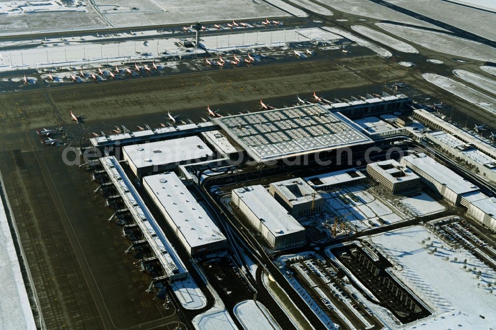 Aerial image Schönefeld - Wintry snowy dispatch building and terminals on the premises of the airport BER in Schoenefeld in the state Brandenburg