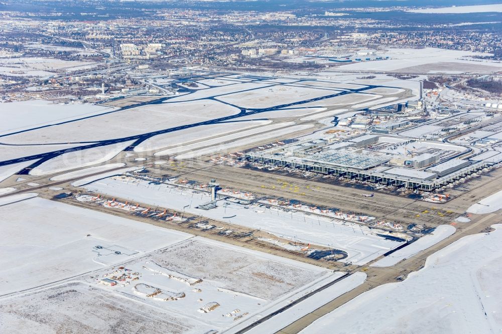 Aerial image Schönefeld - Wintry snowy dispatch building and terminals on the premises of the airport BER in Schoenefeld in the state Brandenburg