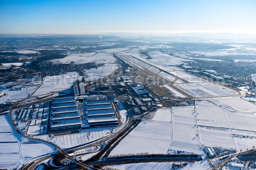 Leinfelden-Echterdingen from above - Wintry snowy dispatch building and terminals on the premises of the airport Stuttgart in the district Bernhausen in Leinfelden-Echterdingen in the state Baden-Wuerttemberg, Germany