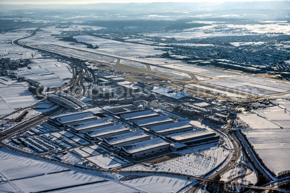 Leinfelden-Echterdingen from the bird's eye view: Wintry snowy dispatch building and terminals on the premises of the airport Stuttgart in the district Bernhausen in Leinfelden-Echterdingen in the state Baden-Wuerttemberg, Germany