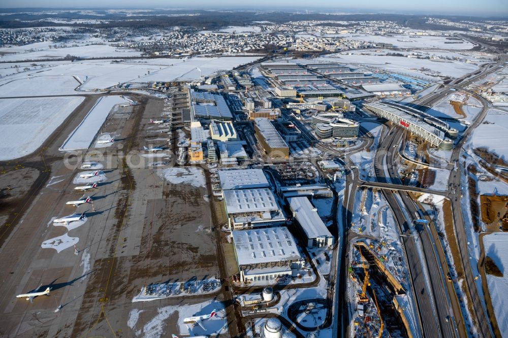 Leinfelden-Echterdingen from the bird's eye view: Wintry snowy dispatch building and terminals on the premises of the airport Stuttgart in Leinfelden-Echterdingen in the state Baden-Wuerttemberg, Germany